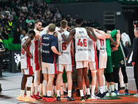 Players from Baskonia Vitoria-Gasteiz and Panathinaikos AKTOR Athens pray together for Mathias Lessort after he is injured following the Eur...