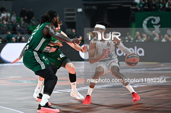 Chima Moneke of Baskonia Vitoria-Gasteiz competes with Mathias Lessort and Juancho Hernangomez of Panathinaikos AKTOR Athens during the Euro...