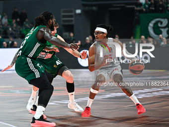 Chima Moneke of Baskonia Vitoria-Gasteiz competes with Mathias Lessort and Juancho Hernangomez of Panathinaikos AKTOR Athens during the Euro...