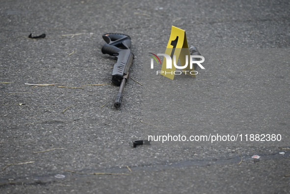 The NYPD Crime Scene Unit places evidence markers at the scene to highlight the weapon and other evidence found where an unidentified man is...