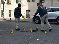 The NYPD Crime Scene Unit places evidence markers at the scene to highlight the weapon and other evidence found where an unidentified man is...