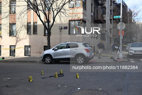 The NYPD Crime Scene Unit places evidence markers at the scene to highlight the weapon and other evidence found where an unidentified man is...