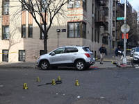 The NYPD Crime Scene Unit places evidence markers at the scene to highlight the weapon and other evidence found where an unidentified man is...