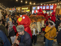 Iranian performers perform during a pomegranate festival on Yalda Night Eve in the Abasabad tourism zone in central Tehran, Iran, on Decembe...