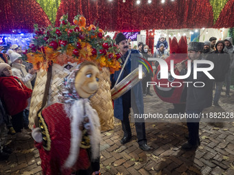 Iranian street musicians and performers play Iranian traditional music and dance during a pomegranate festival on Yalda Night Eve in the Aba...