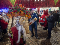 Iranian street musicians and performers play Iranian traditional music and dance during a pomegranate festival on Yalda Night Eve in the Aba...