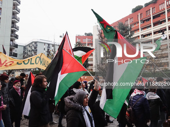 Demonstrators participate in the 62nd Saturday of the demonstration in support of Palestine in the Corvetto district in Milan, Italy, on Dec...