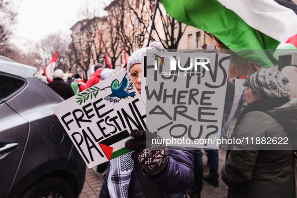 Demonstrators participate in the 62nd Saturday of the demonstration in support of Palestine in the Corvetto district in Milan, Italy, on Dec...