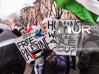 Demonstrators participate in the 62nd Saturday of the demonstration in support of Palestine in the Corvetto district in Milan, Italy, on Dec...