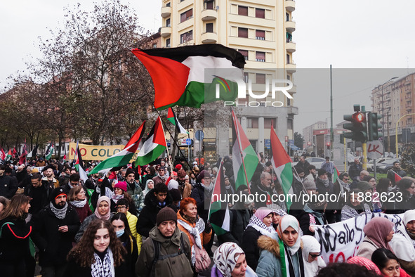 Demonstrators participate in the 62nd Saturday of the demonstration in support of Palestine in the Corvetto district in Milan, Italy, on Dec...