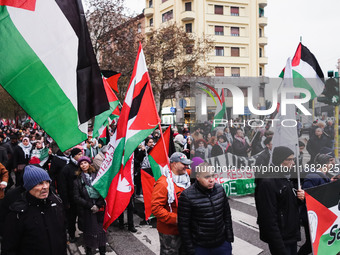 Demonstrators participate in the 62nd Saturday of the demonstration in support of Palestine in the Corvetto district in Milan, Italy, on Dec...