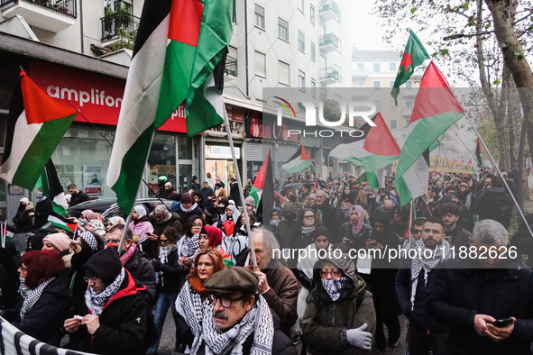 Demonstrators participate in the 62nd Saturday of the demonstration in support of Palestine in the Corvetto district in Milan, Italy, on Dec...