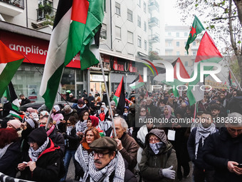 Demonstrators participate in the 62nd Saturday of the demonstration in support of Palestine in the Corvetto district in Milan, Italy, on Dec...