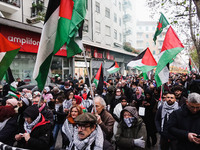 Demonstrators participate in the 62nd Saturday of the demonstration in support of Palestine in the Corvetto district in Milan, Italy, on Dec...