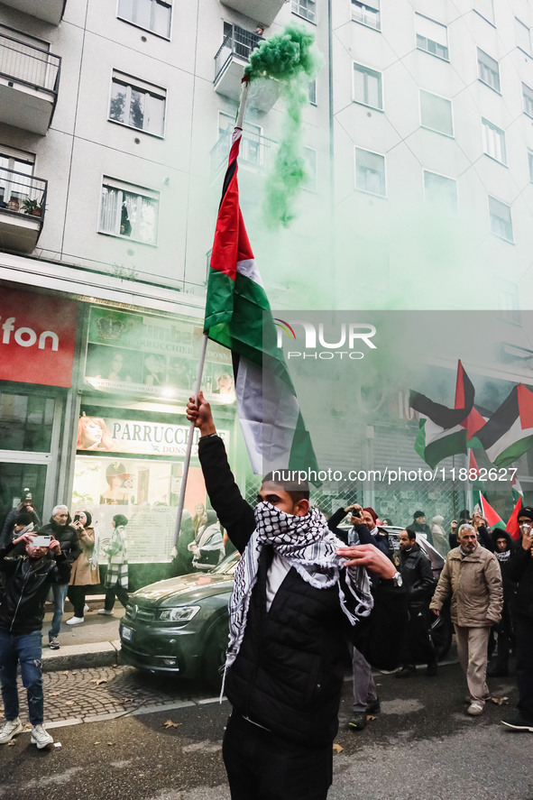 Demonstrators participate in the 62nd Saturday of the demonstration in support of Palestine in the Corvetto district in Milan, Italy, on Dec...