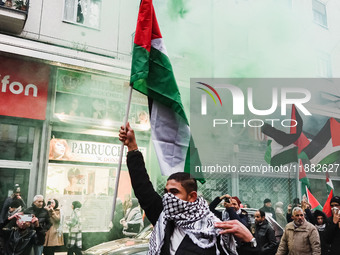 Demonstrators participate in the 62nd Saturday of the demonstration in support of Palestine in the Corvetto district in Milan, Italy, on Dec...