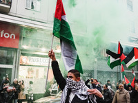 Demonstrators participate in the 62nd Saturday of the demonstration in support of Palestine in the Corvetto district in Milan, Italy, on Dec...