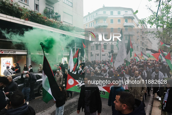 Demonstrators participate in the 62nd Saturday of the demonstration in support of Palestine in the Corvetto district in Milan, Italy, on Dec...