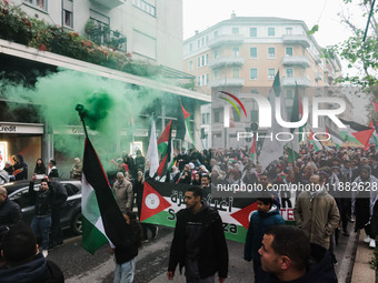 Demonstrators participate in the 62nd Saturday of the demonstration in support of Palestine in the Corvetto district in Milan, Italy, on Dec...