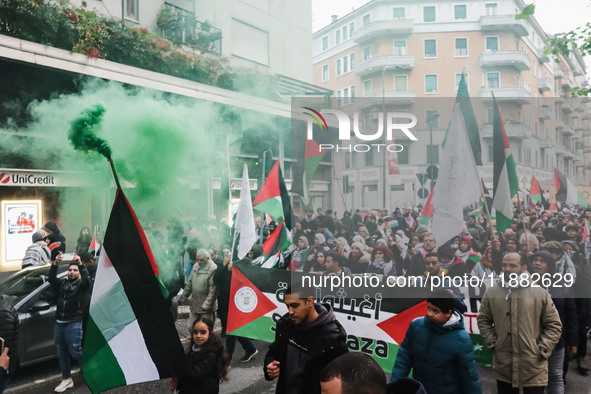 Demonstrators participate in the 62nd Saturday of the demonstration in support of Palestine in the Corvetto district in Milan, Italy, on Dec...