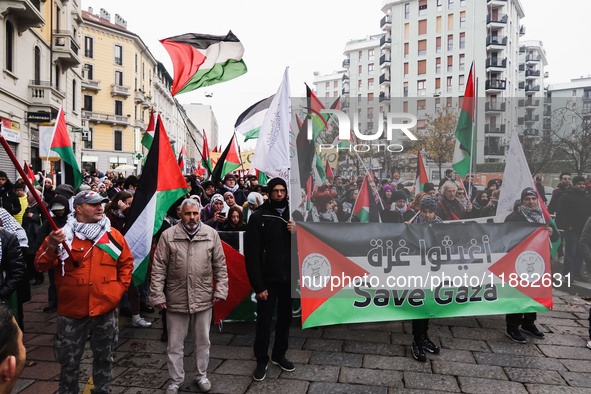 Demonstrators participate in the 62nd Saturday of the demonstration in support of Palestine in the Corvetto district in Milan, Italy, on Dec...