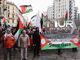 Demonstrators participate in the 62nd Saturday of the demonstration in support of Palestine in the Corvetto district in Milan, Italy, on Dec...