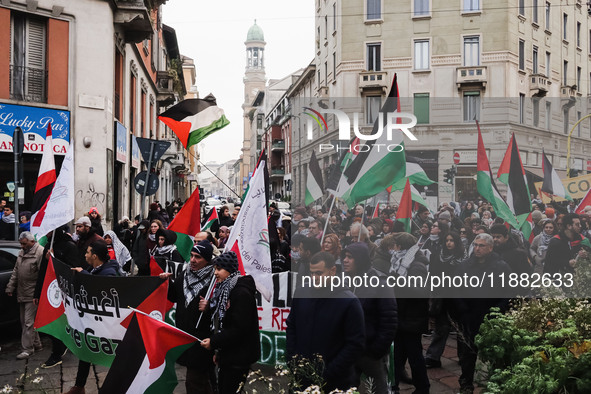 Demonstrators participate in the 62nd Saturday of the demonstration in support of Palestine in the Corvetto district in Milan, Italy, on Dec...