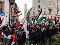 Demonstrators participate in the 62nd Saturday of the demonstration in support of Palestine in the Corvetto district in Milan, Italy, on Dec...