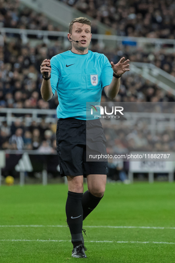 Match referee Samuel Barrott officiates during the Carabao Cup Quarter Final match between Newcastle United and Brentford at St. James's Par...