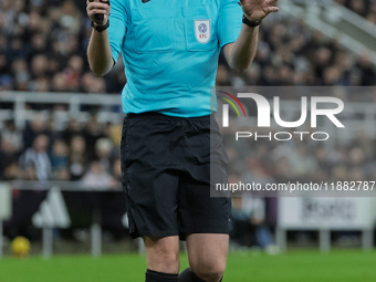 Match referee Samuel Barrott officiates during the Carabao Cup Quarter Final match between Newcastle United and Brentford at St. James's Par...