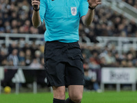 Match referee Samuel Barrott officiates during the Carabao Cup Quarter Final match between Newcastle United and Brentford at St. James's Par...