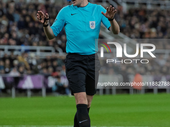 Match referee Samuel Barrott officiates during the Carabao Cup Quarter Final match between Newcastle United and Brentford at St. James's Par...