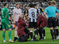 Newcastle United's Joelinton receives treatment for a facial wound during the Carabao Cup Quarter Final match between Newcastle United and B...