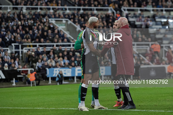 Newcastle United's Joelinton receives treatment for a facial wound during the Carabao Cup Quarter Final match between Newcastle United and B...