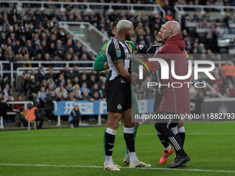 Newcastle United's Joelinton receives treatment for a facial wound during the Carabao Cup Quarter Final match between Newcastle United and B...