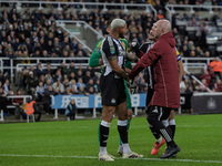 Newcastle United's Joelinton receives treatment for a facial wound during the Carabao Cup Quarter Final match between Newcastle United and B...