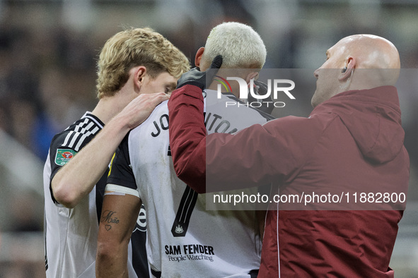 Newcastle United's Joelinton receives treatment for a facial wound during the Carabao Cup Quarter Final match between Newcastle United and B...