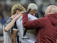 Newcastle United's Joelinton receives treatment for a facial wound during the Carabao Cup Quarter Final match between Newcastle United and B...