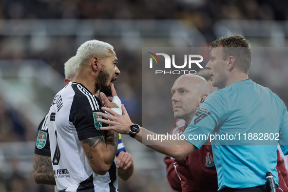 Newcastle United's Joelinton receives treatment for a facial wound during the Carabao Cup Quarter Final match between Newcastle United and B...