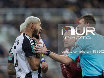 Newcastle United's Joelinton receives treatment for a facial wound during the Carabao Cup Quarter Final match between Newcastle United and B...