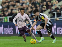 Tino Livramento of Newcastle United competes with Fabio Carvalho of Brentford during the Carabao Cup Quarter Final match between Newcastle U...