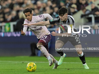 Tino Livramento of Newcastle United competes with Fabio Carvalho of Brentford during the Carabao Cup Quarter Final match between Newcastle U...