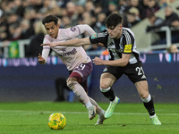 Tino Livramento of Newcastle United competes with Fabio Carvalho of Brentford during the Carabao Cup Quarter Final match between Newcastle U...