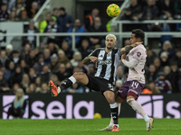 Bruno Guimaraes of Newcastle United competes with Fabio Carvalho of Brentford during the Carabao Cup Quarter Final match between Newcastle U...