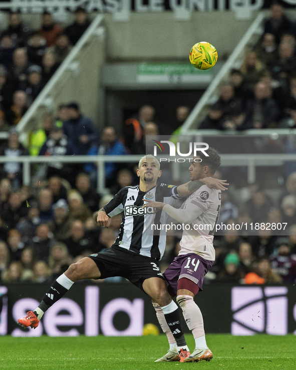 Bruno Guimaraes of Newcastle United competes with Fabio Carvalho of Brentford during the Carabao Cup Quarter Final match between Newcastle U...