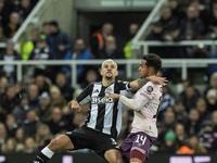 Bruno Guimaraes of Newcastle United competes with Fabio Carvalho of Brentford during the Carabao Cup Quarter Final match between Newcastle U...