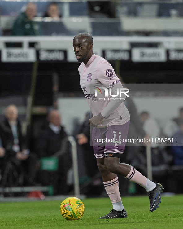 Yoane Wissa of Brentford is in action during the Carabao Cup Quarter Final match between Newcastle United and Brentford at St. James's Park...