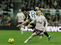 Tino Livramento of Newcastle United is in action with Brentford's Keane Lewis-Potter during the Carabao Cup Quarter Final match between Newc...