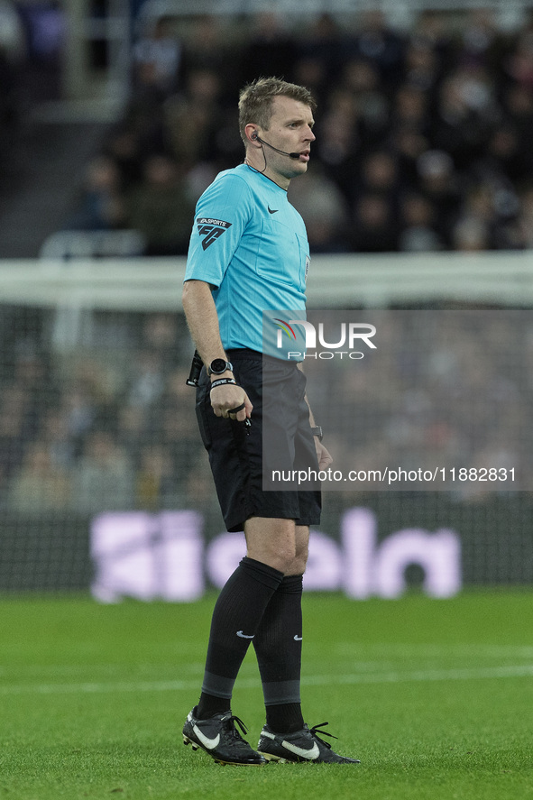 Match referee Samuel Barrott officiates during the Carabao Cup Quarter Final match between Newcastle United and Brentford at St. James's Par...