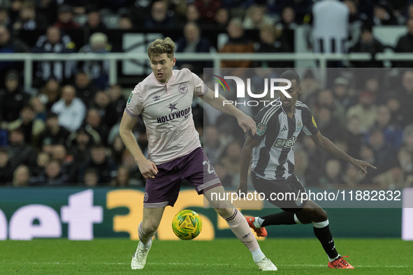 Brentford's Nathan Collins competes with Newcastle United's Alexander Isak during the Carabao Cup Quarter Final match between Newcastle Unit...